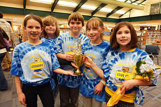 Battle of the Books team holding the trophy.