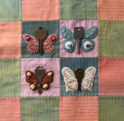 “Lost Keys” (detail) by Rita Browning Detail image of a mixed media quilt with moth designs.