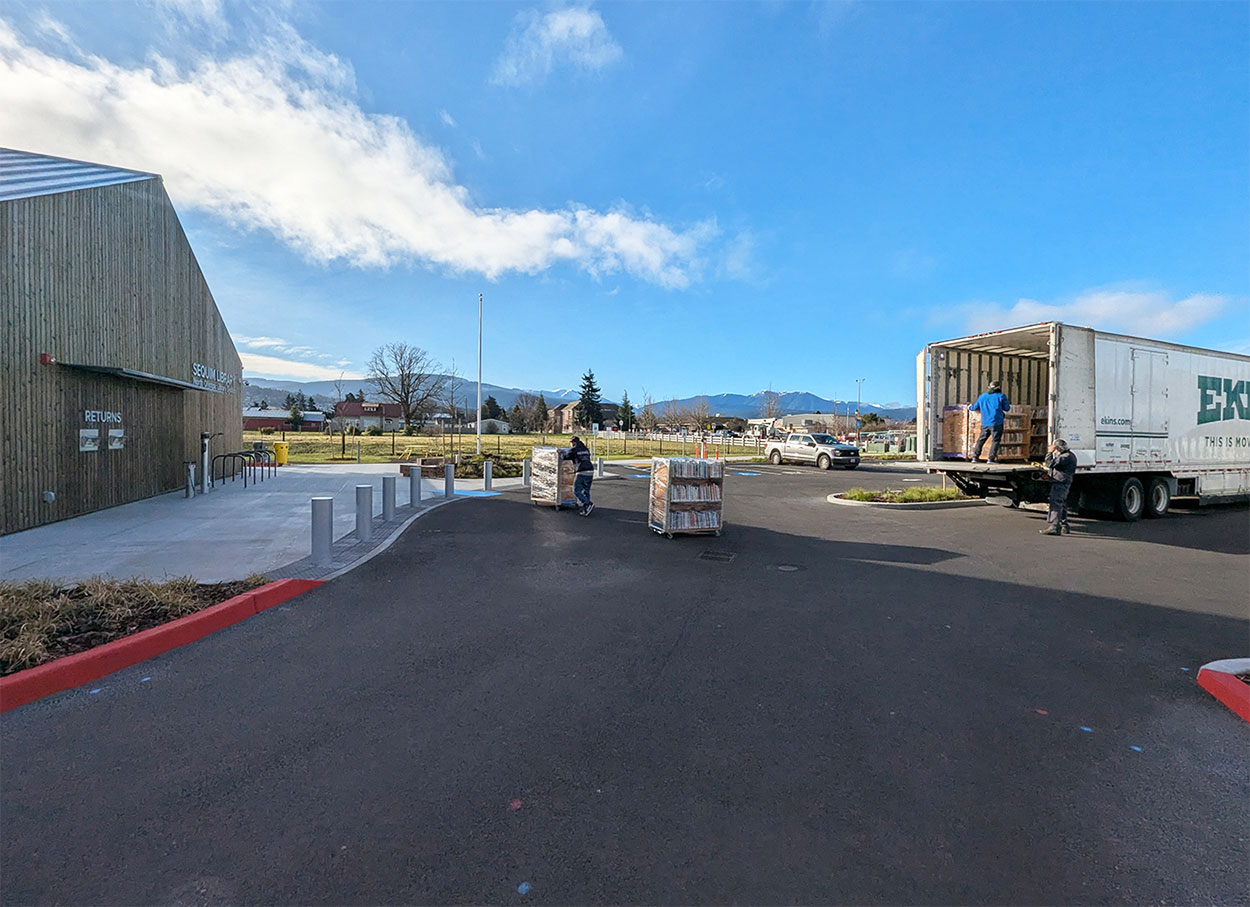 Moving carts are carefully lowered using a lift gate.