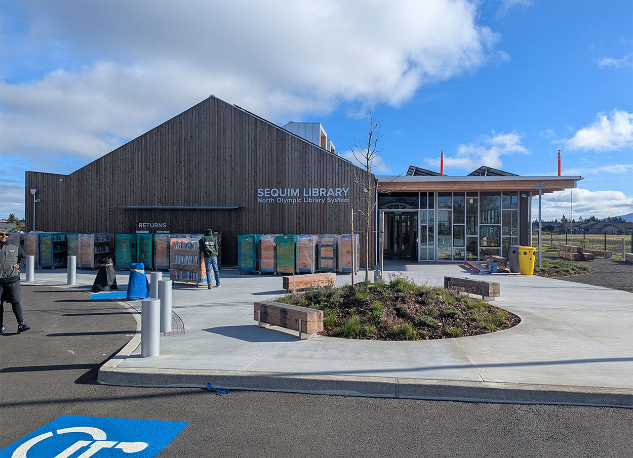 Moving carts are lined up in front of the new building.