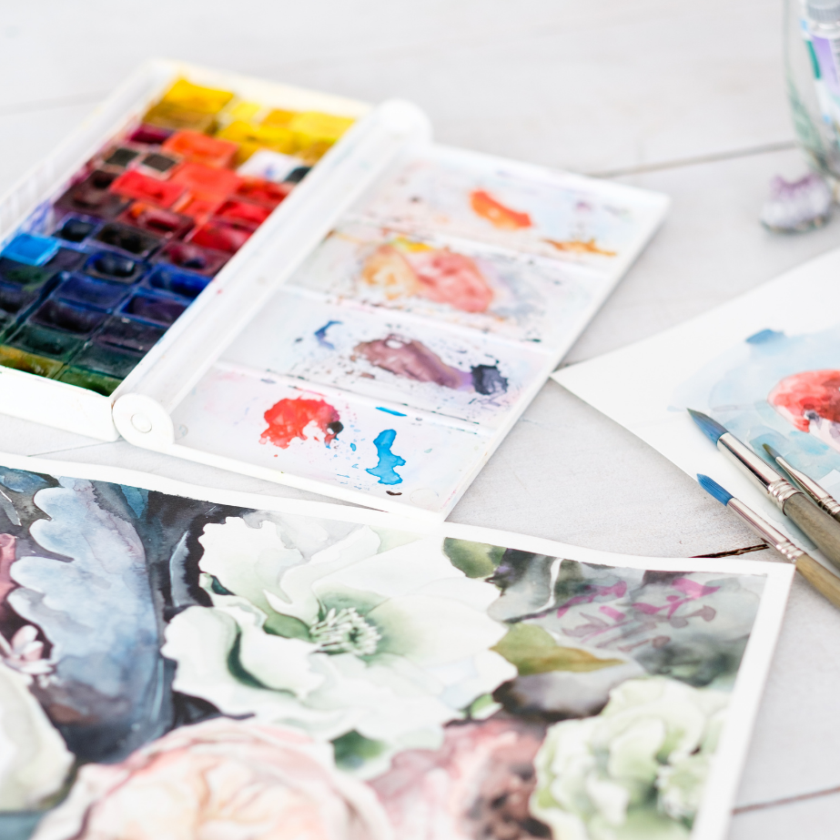 Watercolor palette, brushes and painting.